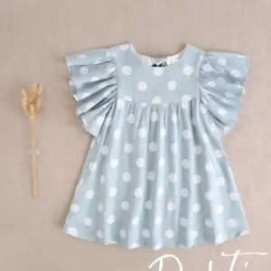 VESTIDO NIÑA FONDO AZUL Y LUNARES CON ESPALDA ABIERTA