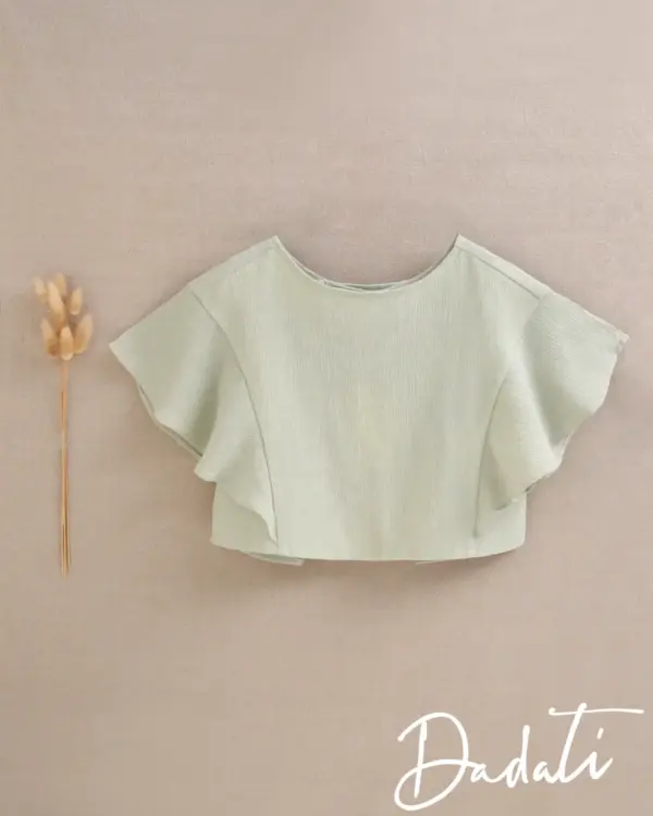blusa niña verde espalda abierta y volante en manga
