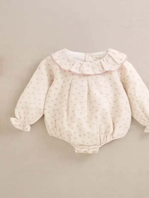 Ranita de bebé niña en beige con volante en el cuello